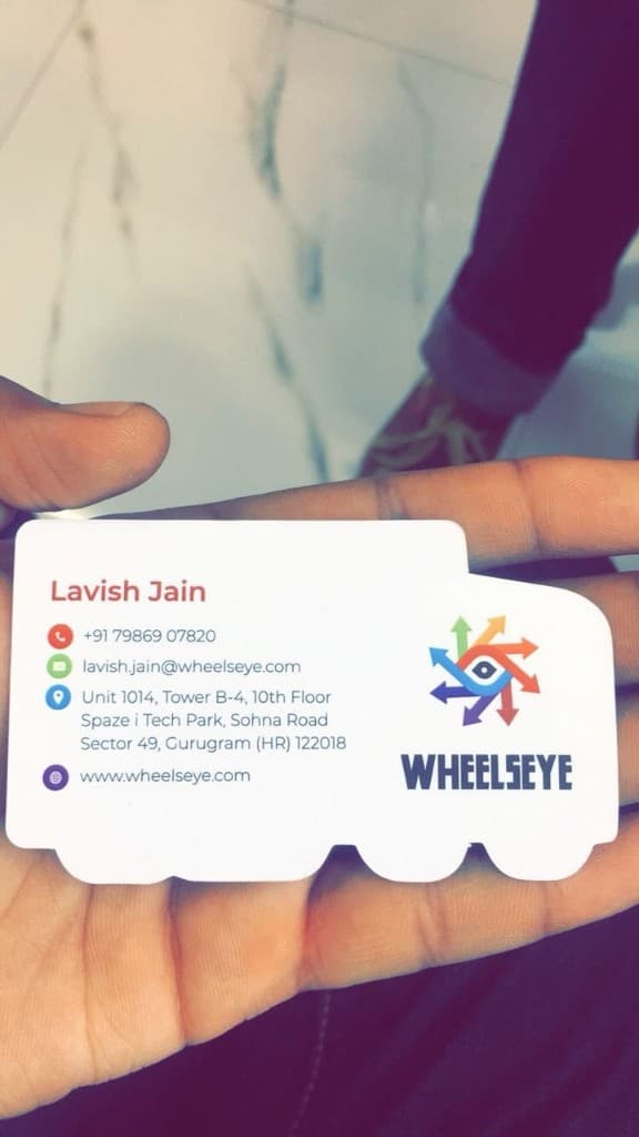 WheelsEye truck business card contact side with Lavish Jain details in the cab area
