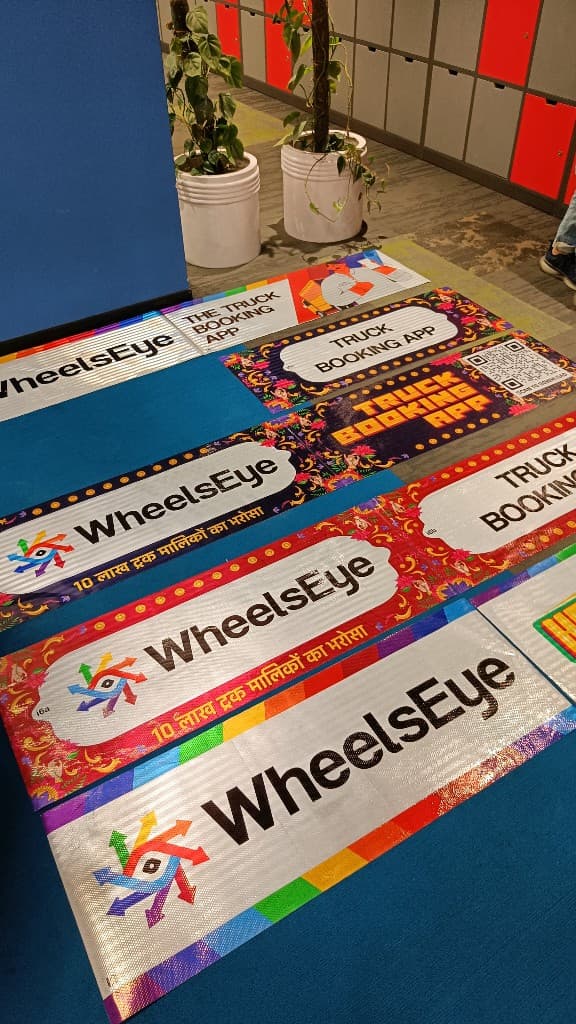 A row of WheelsEye truck booking app sticker designs in standard and truck art styles